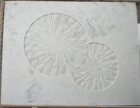 Twin Radiating Disc Stone Relief — OS-SM-102